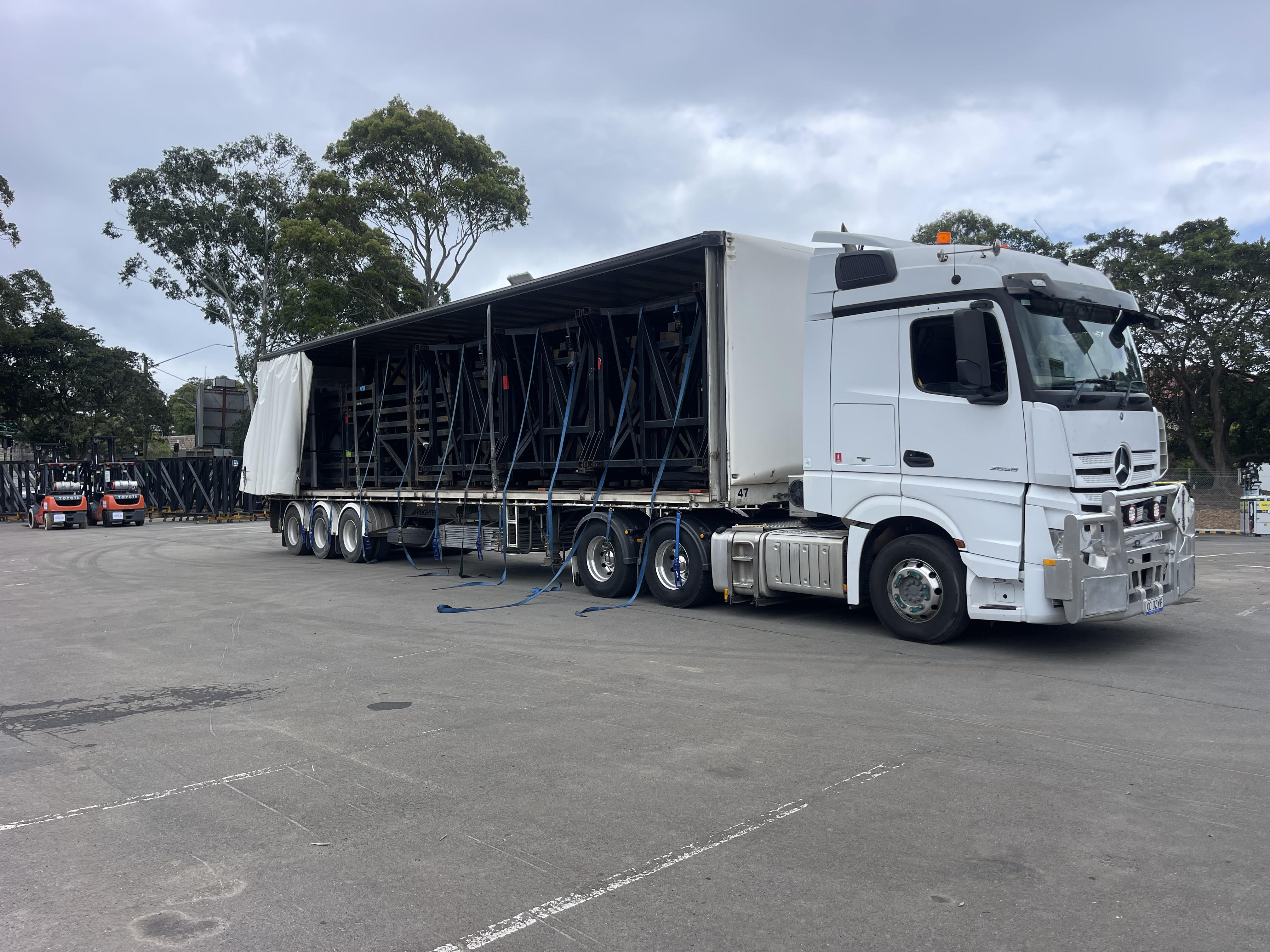 Quick Cargo medium rigid truck being loaded for same day interstate freight transport